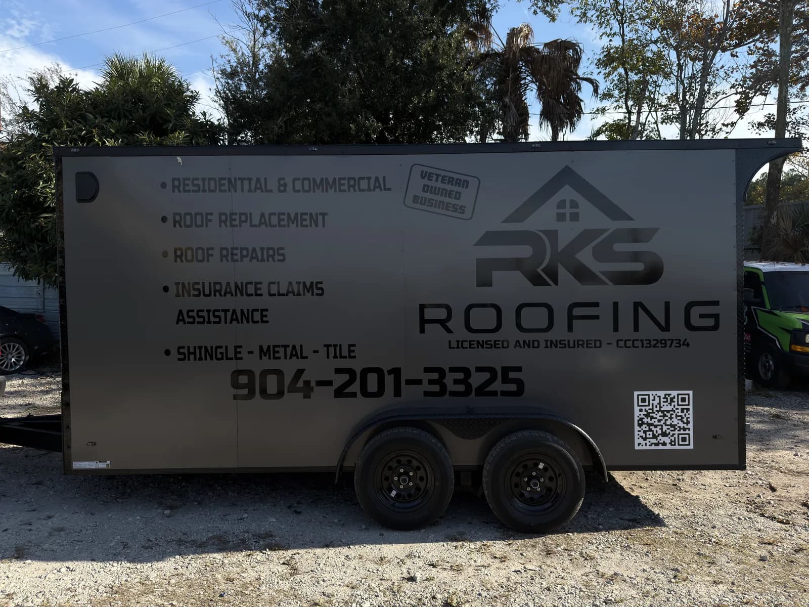 Enclosed trailer with a full wrap for a roofing company