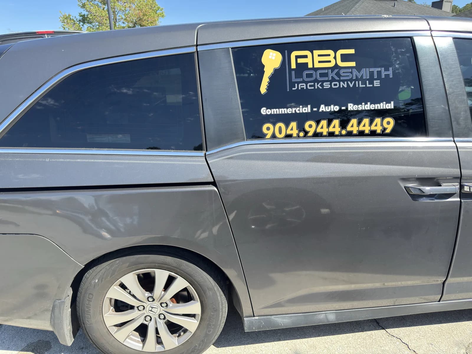 Side decals on a minivan for a Jacksonville locksmith