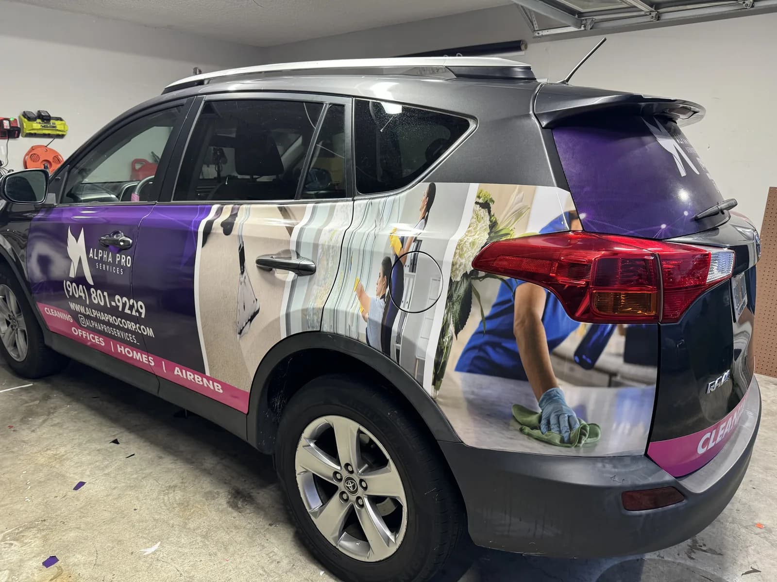SUV with a partial wrap being finished in the shop